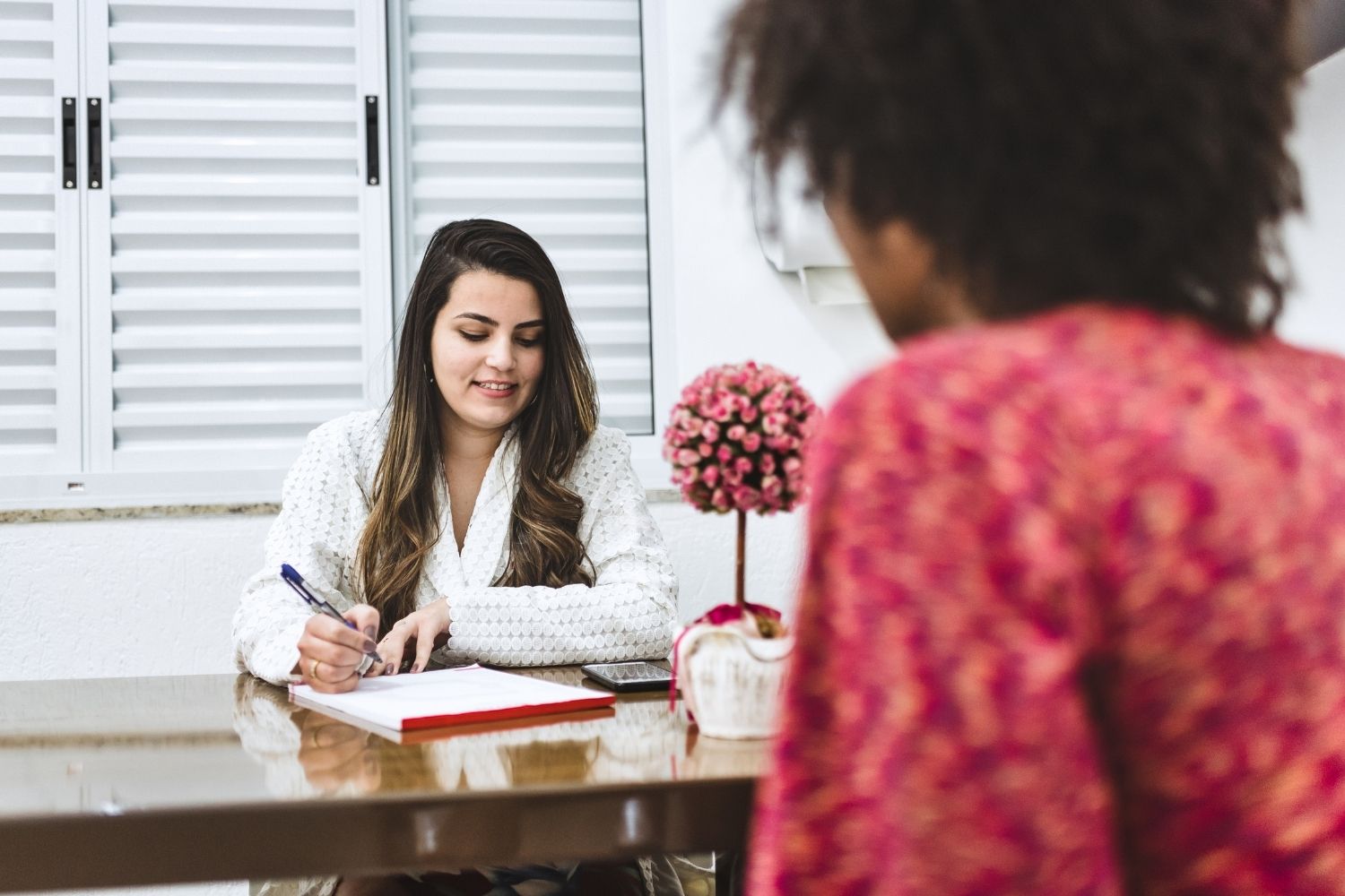 Functional medicine practitioner consulting with a patient about their health and customized IV therapy plan